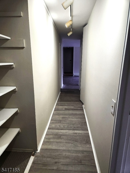 365 River Road, Unit E Nutley, NJ 07110 - Photo 8 of 14 a view of a hallway with wooden floor and staircase