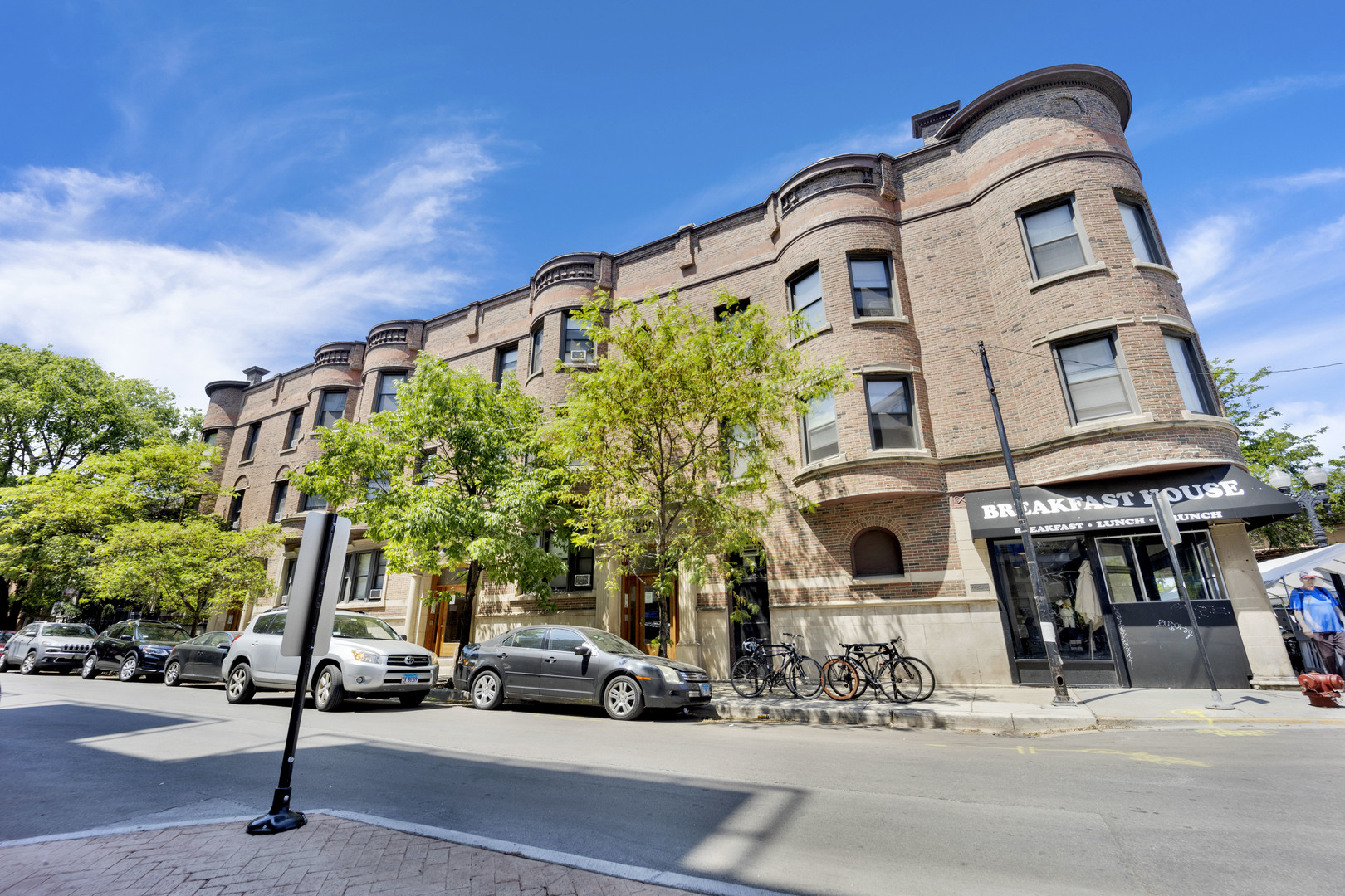 3932 North Sheridan Road, Unit 2 Chicago, IL 60613 - Photo 1 of 9 a building with trees in front of it