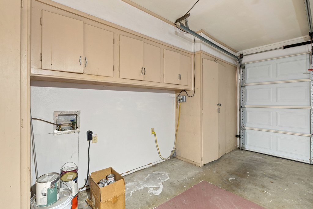 2204 Smith Avenue Taylor, TX 76574 - Photo 34 of 40 Laundry area is located in the garage with lots of storage available.