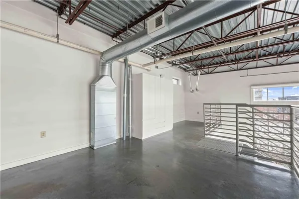 a view of a room with wooden walls