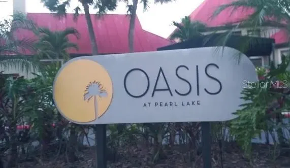 a view of outdoor space with sign board and garden