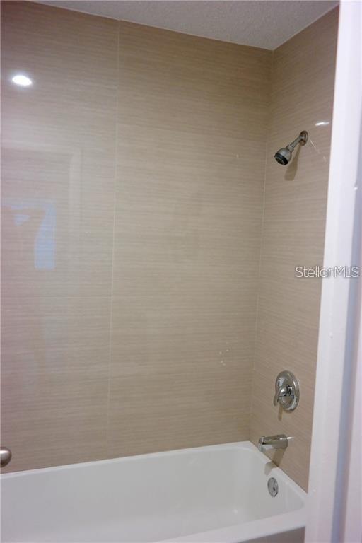 224 Afton Square, Unit 104 Altamonte Springs, FL 32714 - Photo 12 of 13 a bathroom with a bathtub