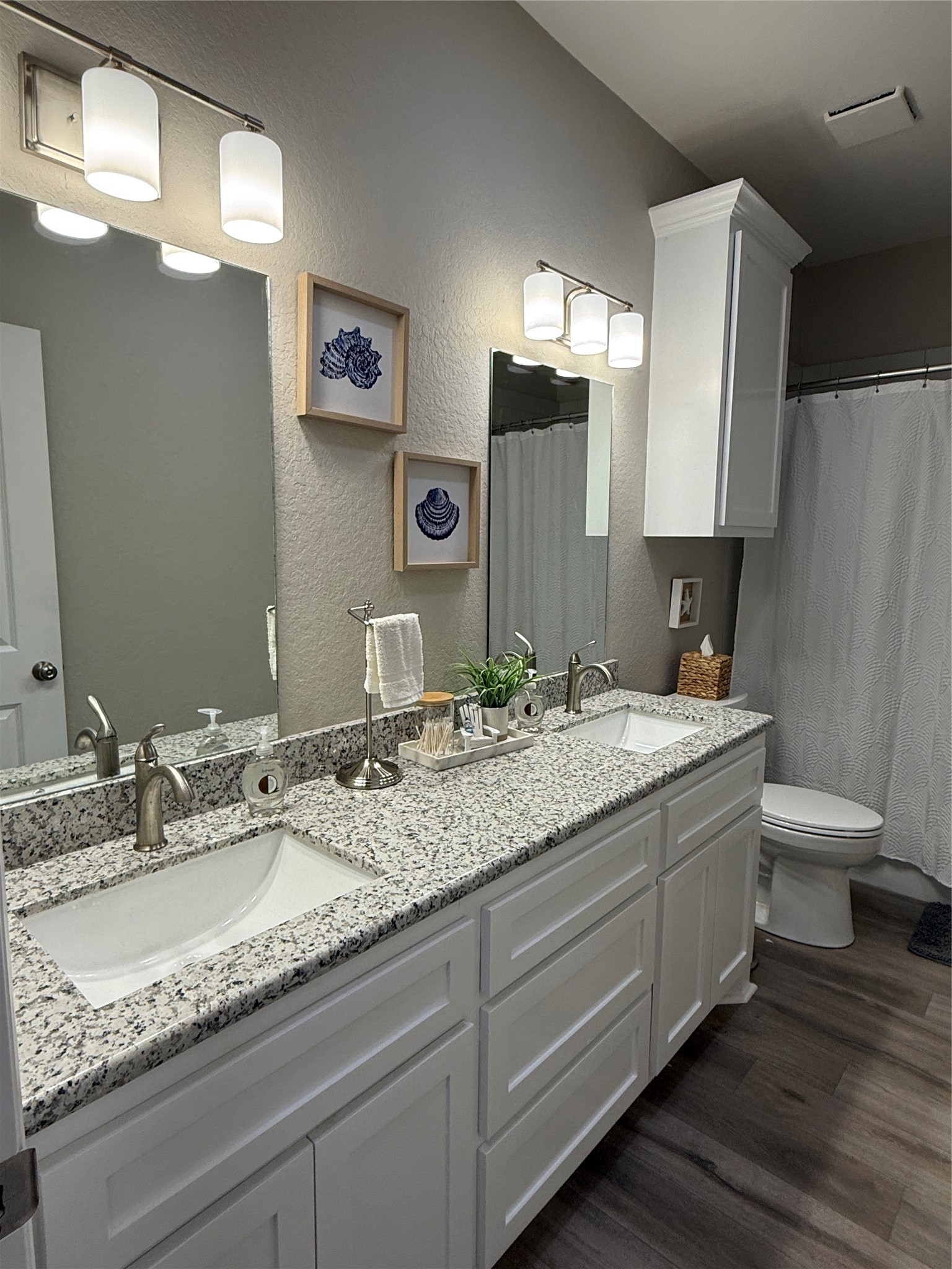 528 Thunder Road Surfside Beach, TX 77541 - Photo 11 of 22 a bathroom with a granite countertop sink a toilet and a mirror