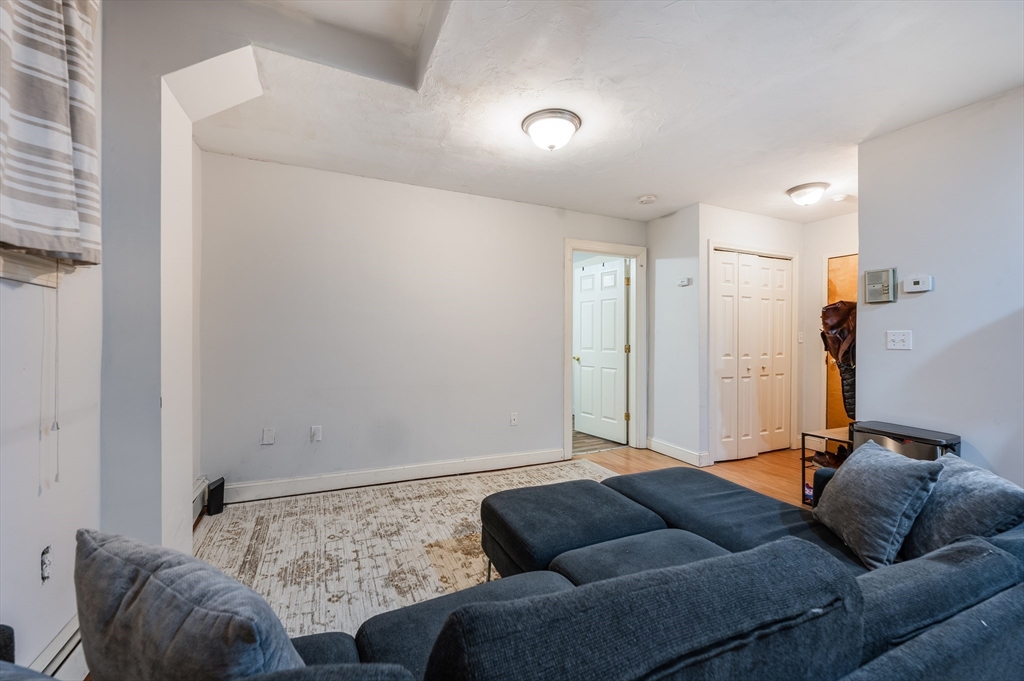 21 Aberdeen Street, Unit B Boston, MA 02215 - Photo 6 of 13 a living room with furniture and a couch