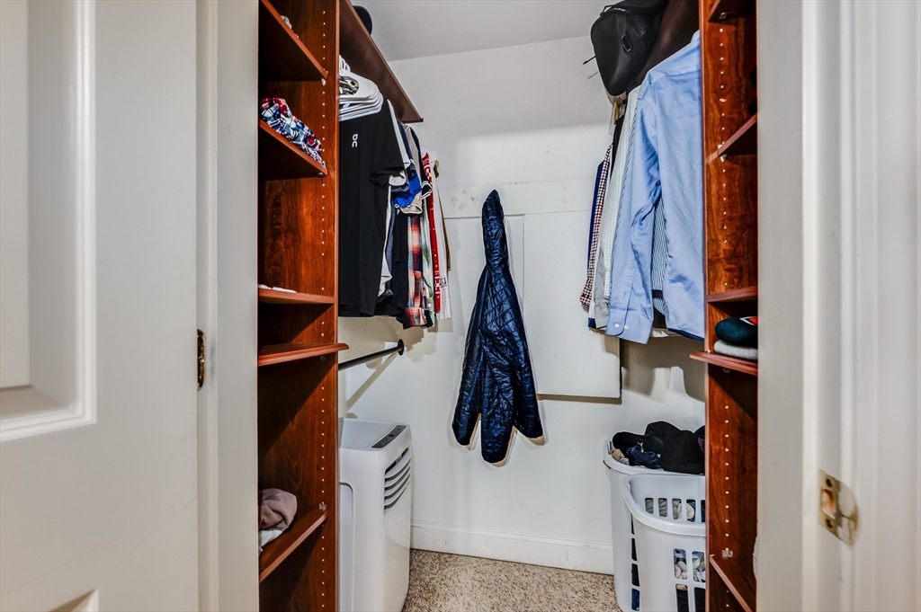 21 Aberdeen Street, Unit B Boston, MA 02215 - Photo 9 of 13 a view of walk in closet with clothes and shoes