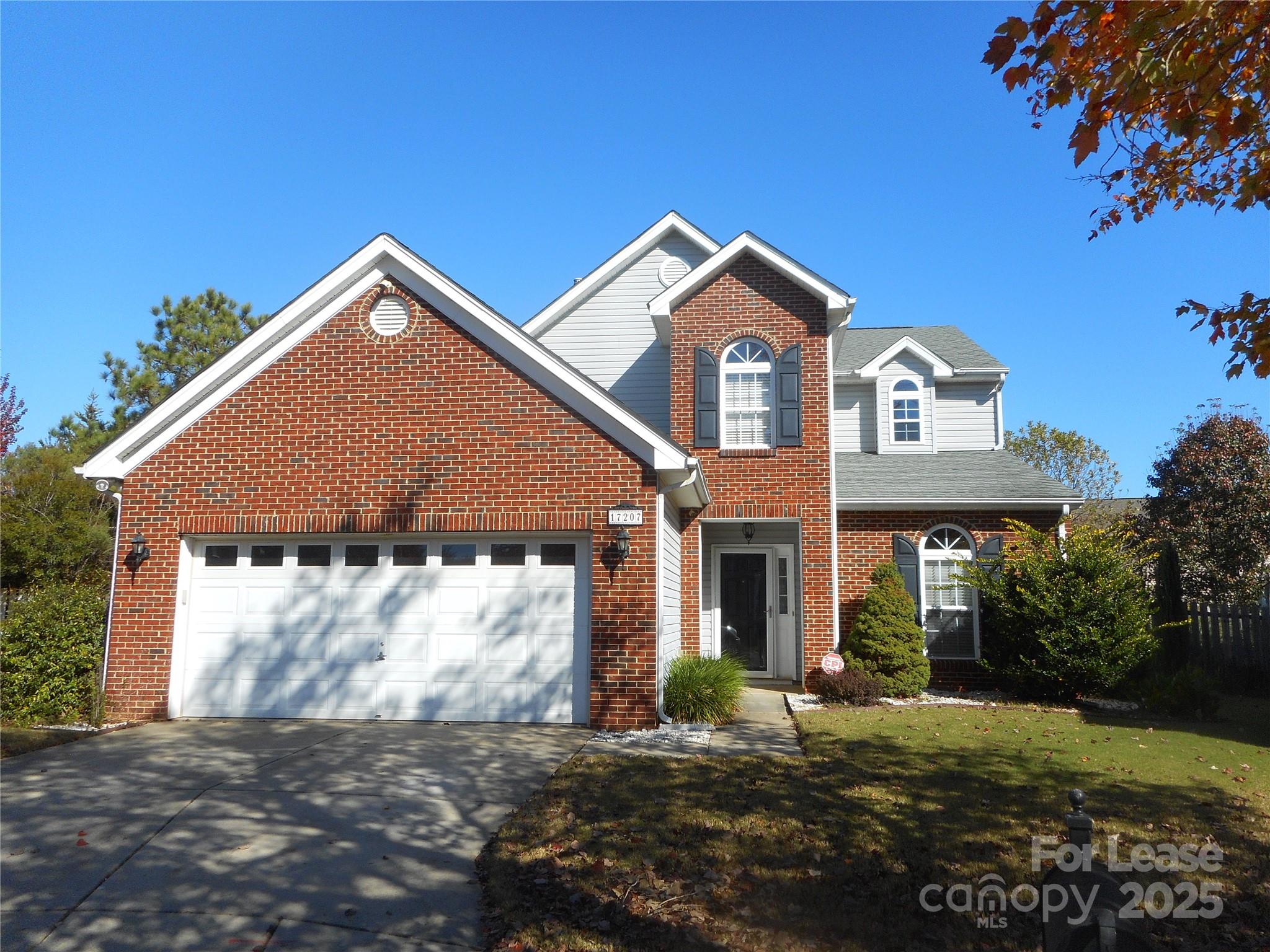 17207 Overstone Court Charlotte, NC 28277 - Photo 1 of 28 a front view of a house with a yard and garage