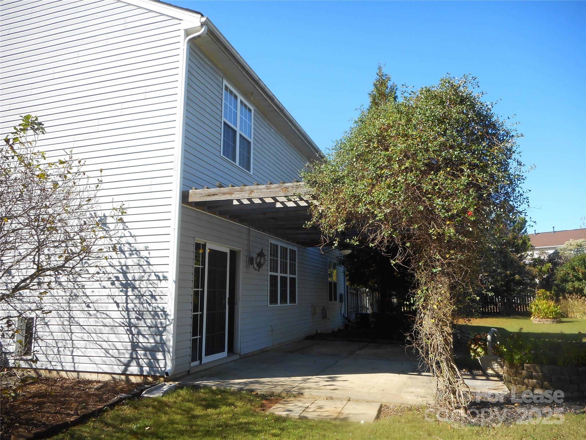 17207 Overstone Court Charlotte, NC 28277 - Photo 13 of 28 a view of a house with a tree in the background
