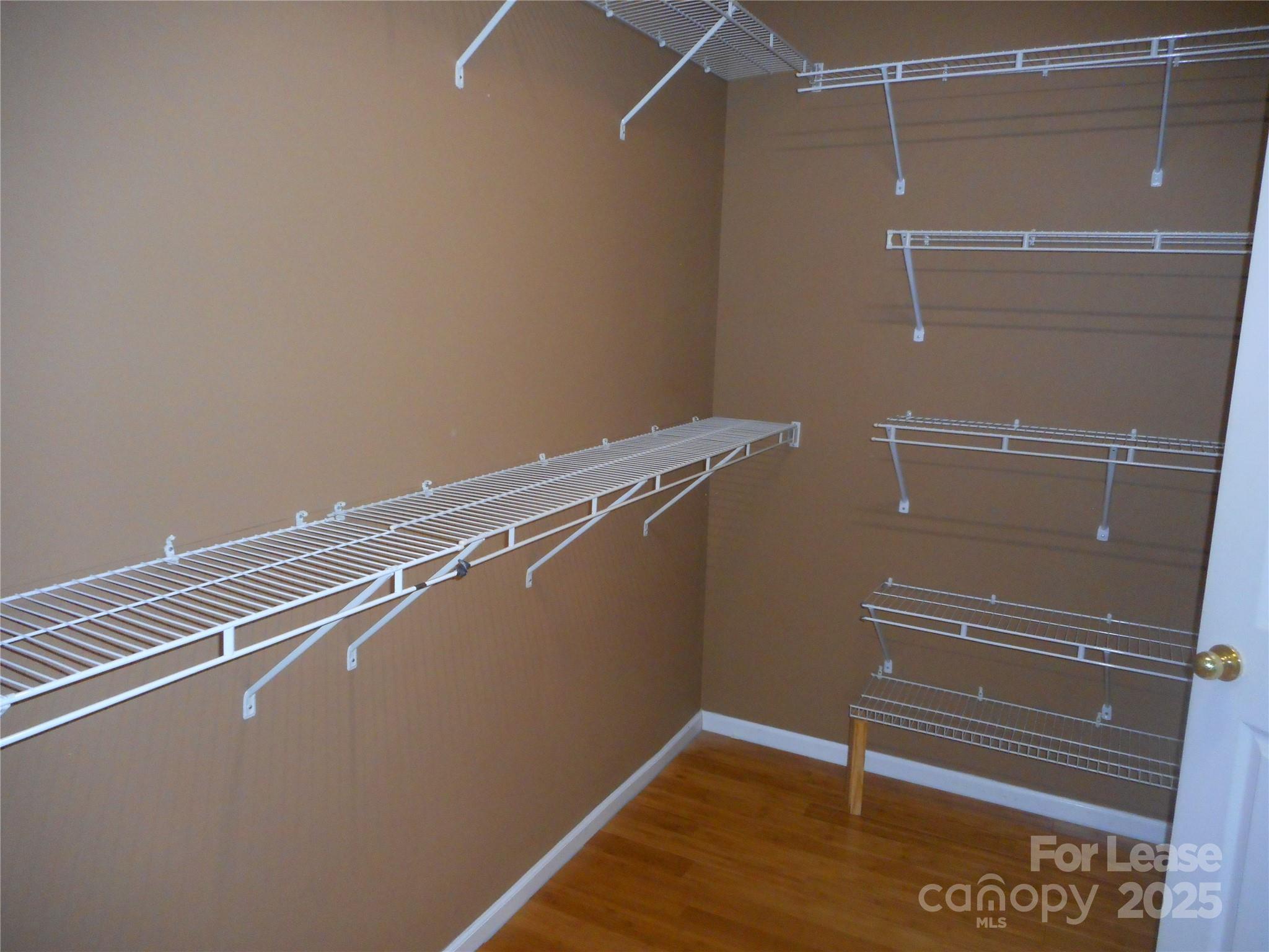 17207 Overstone Court Charlotte, NC 28277 - Photo 19 of 28 a view of a room with wooden floor