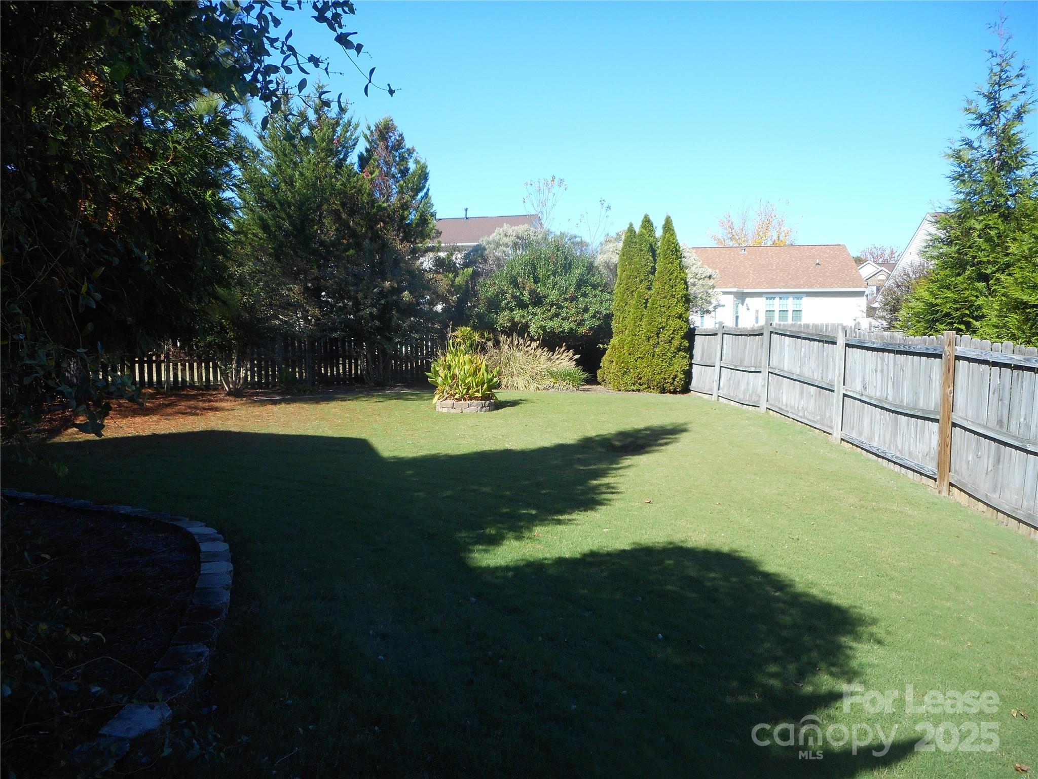 17207 Overstone Court Charlotte, NC 28277 - Photo 10 of 28 a view of a backyard of the house
