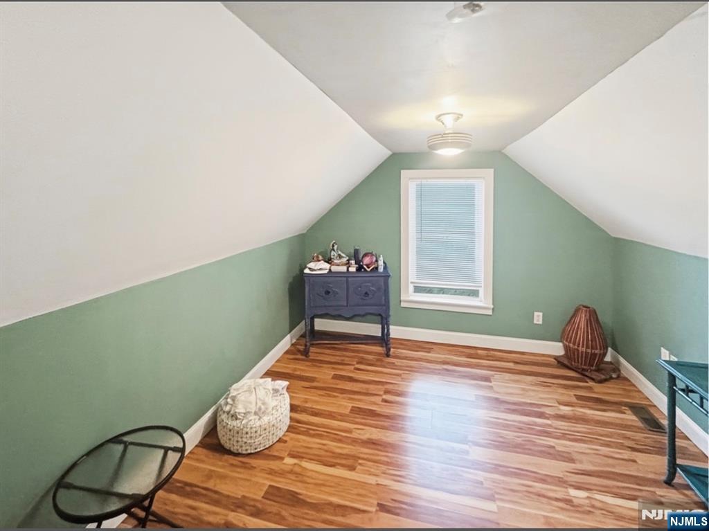 68 Washington Avenue Rutherford, NJ 07070 - Photo 17 of 23 a room with furniture and wooden floor