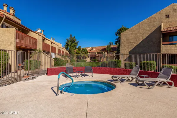 a view of a patio with swimming pool