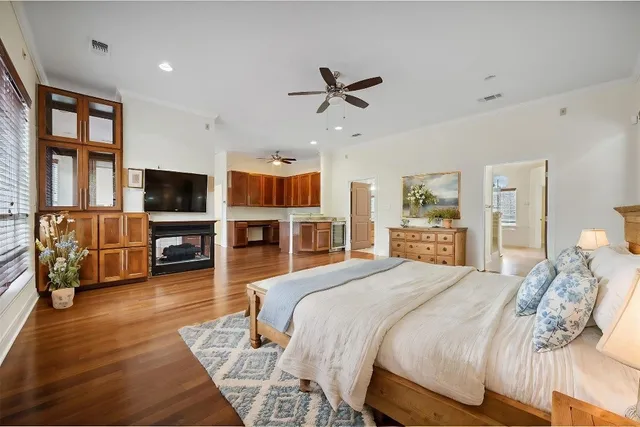 a view of a livingroom with furniture wooden floor and windows