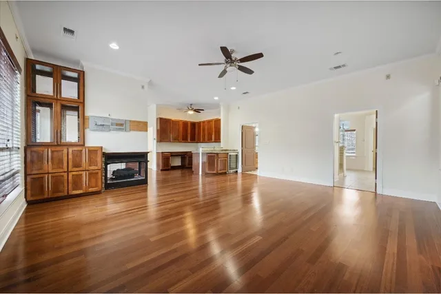 a view of kitchen with furniture and wooden floor