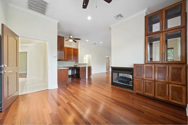 a view of livingroom with hardwood floor and a ceiling fan