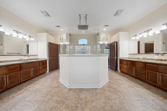 a bathroom with a bathtub and a window