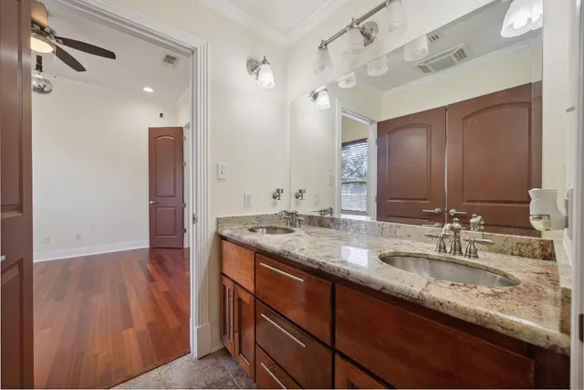 a white toilet sitting next to a bath tub