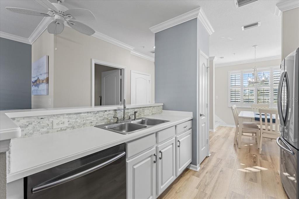 5627 Red Snapper Court New Port Richey, FL 34652 - Photo 19 of 54 a spacious bathroom with a sink double vanity granite and a shower