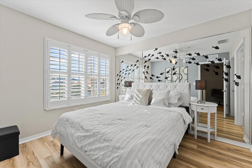 5627 Red Snapper Court New Port Richey, FL 34652 - Photo 30 of 54 a bedroom with a bed and a chandelier