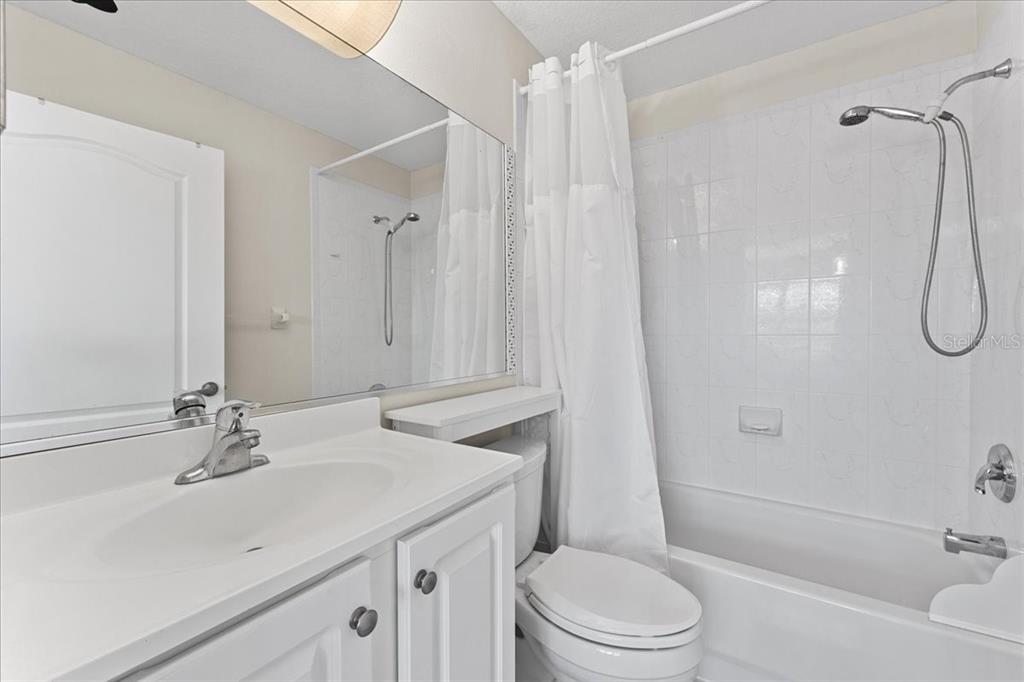 5627 Red Snapper Court New Port Richey, FL 34652 - Photo 33 of 54 a bathroom with a sink a toilet and shower