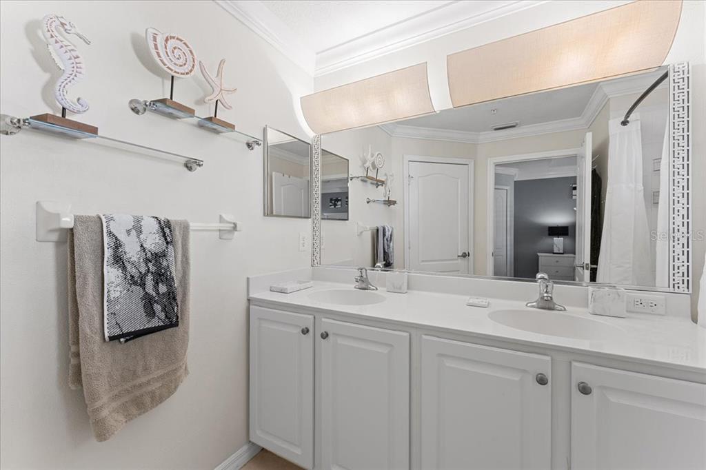 5627 Red Snapper Court New Port Richey, FL 34652 - Photo 39 of 54 a bathroom with a sink vanity and a mirror