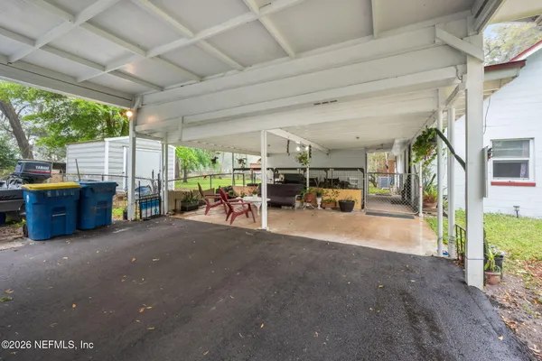 a view of living room with furniture and large trees
