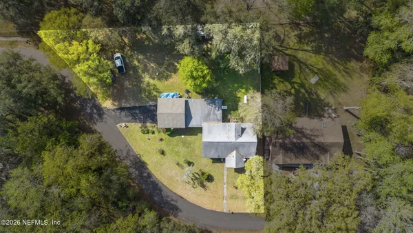 an aerial view of a house with swimming pool