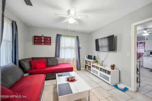a living room with furniture and a flat screen tv