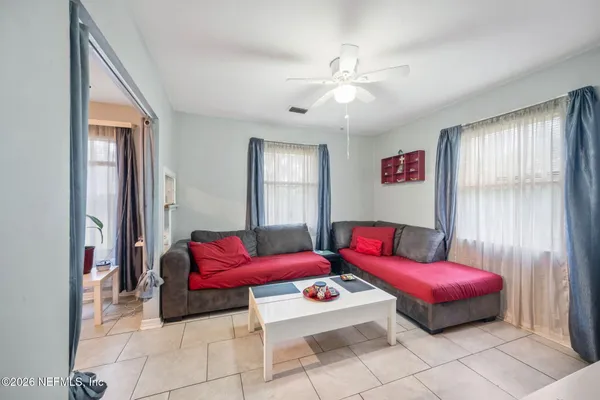 a bedroom with furniture and windows