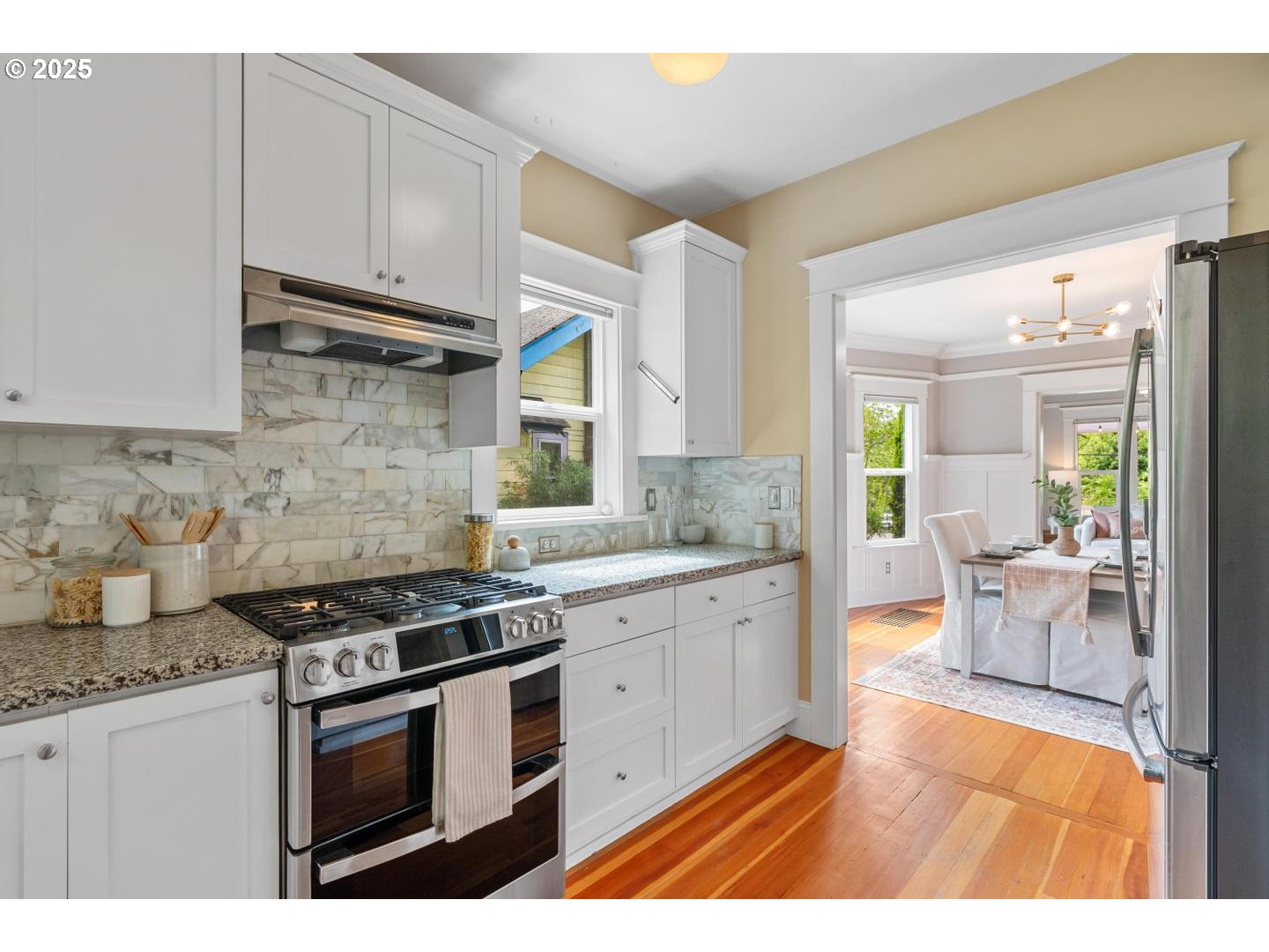 1626 Southeast 35th Avenue Portland, OR 97214 - Photo 11 of 40 a kitchen with stainless steel appliances granite countertop a stove a sink and a granite counter tops