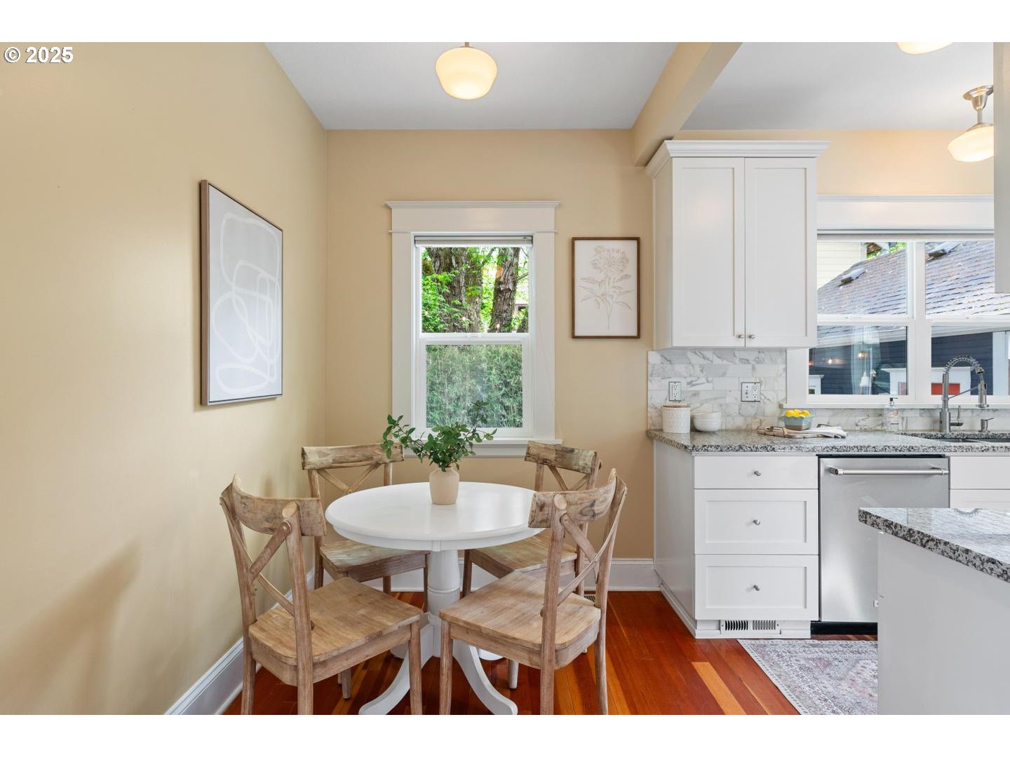 1626 Southeast 35th Avenue Portland, OR 97214 - Photo 14 of 40 a kitchen with a dining table chairs and white appliances