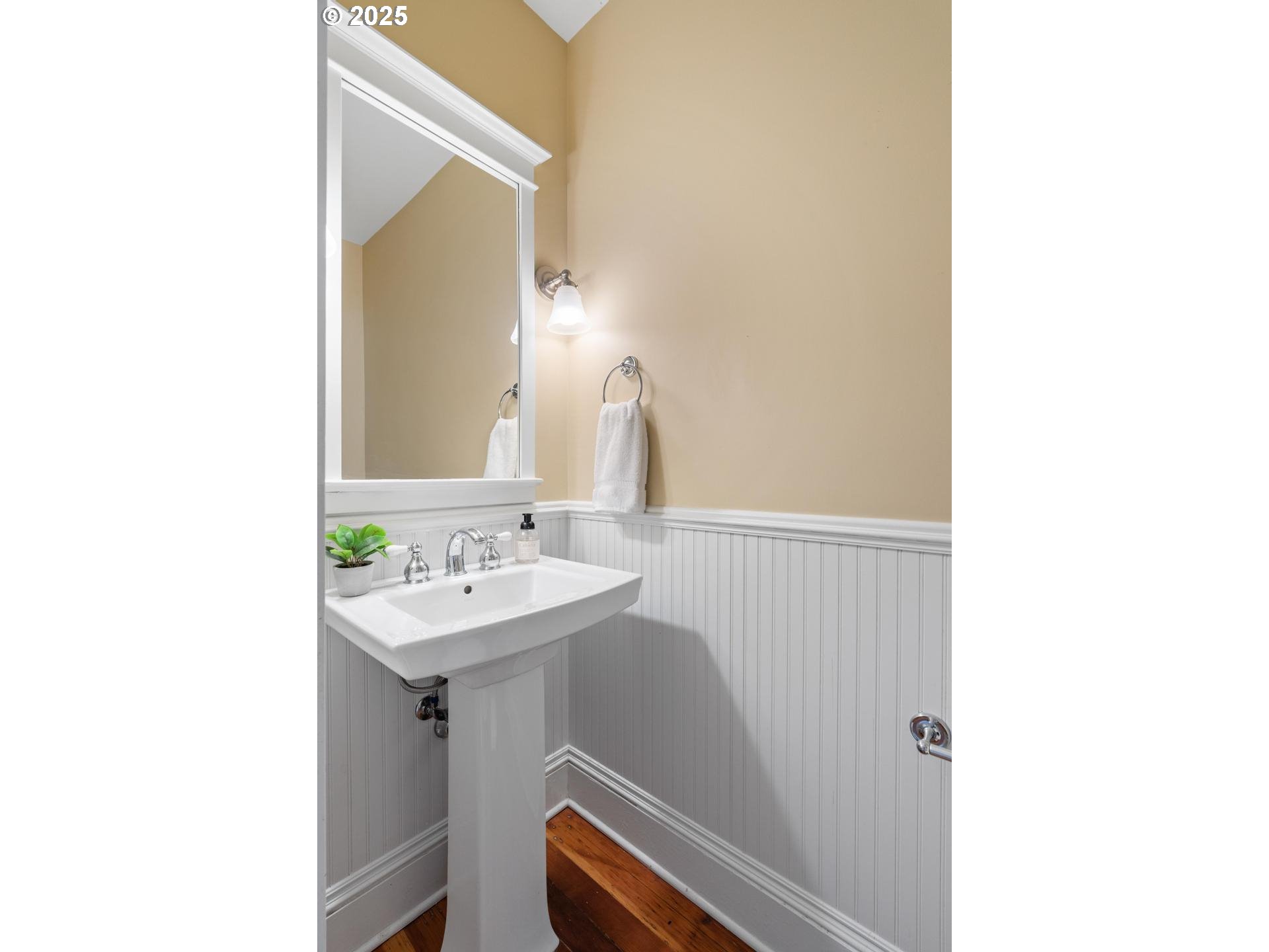 1626 Southeast 35th Avenue Portland, OR 97214 - Photo 17 of 40 a bathroom with a sink a toilet and mirror