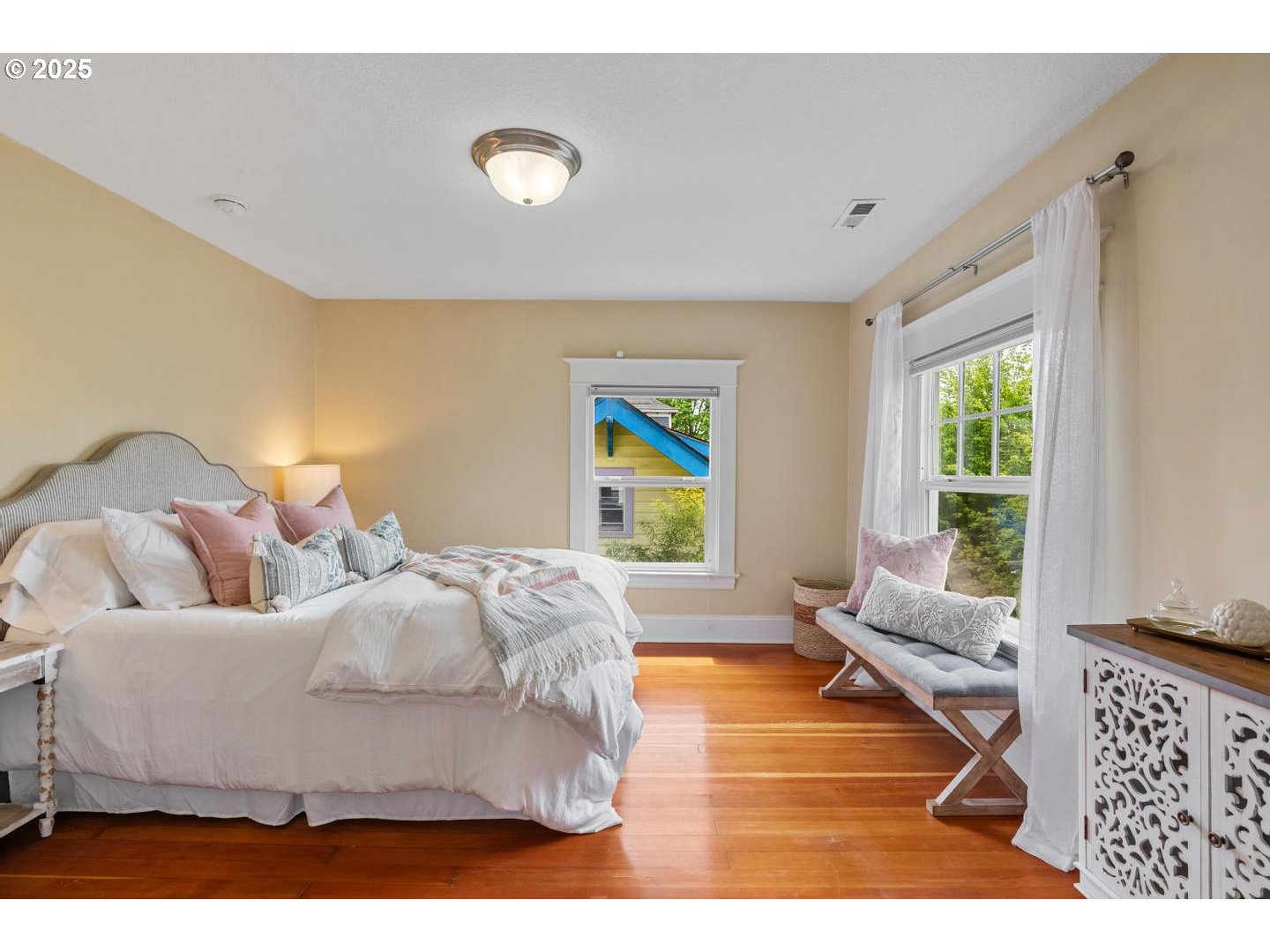 1626 Southeast 35th Avenue Portland, OR 97214 - Photo 20 of 40 a bedroom with a bed and a large window
