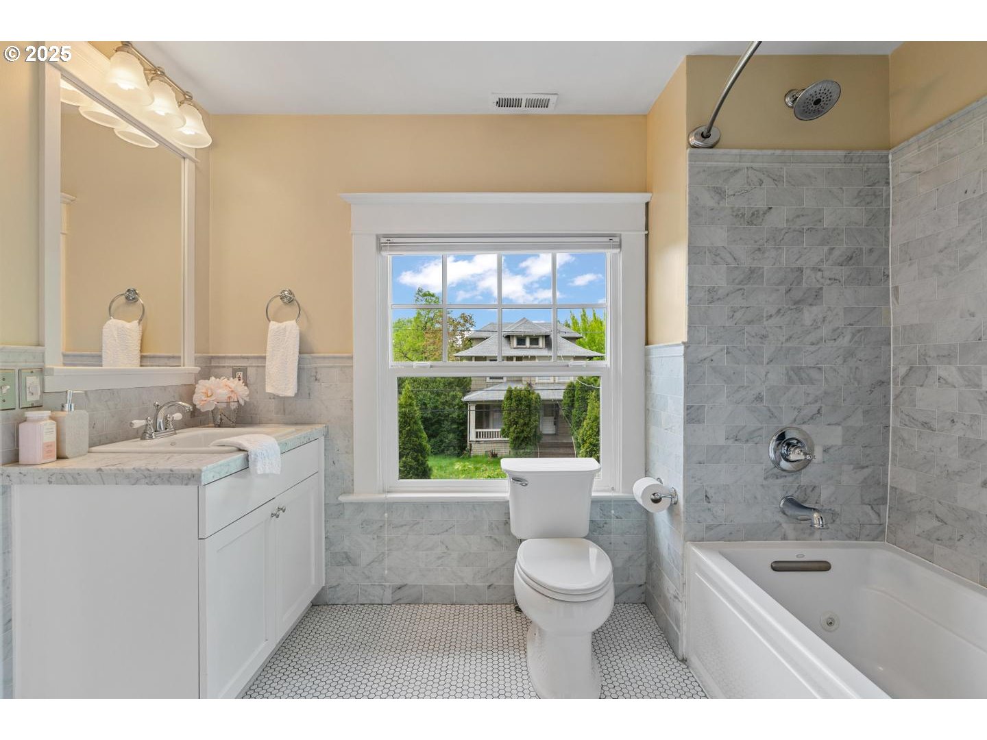 1626 Southeast 35th Avenue Portland, OR 97214 - Photo 22 of 40 a bathroom with a granite countertop sink a large mirror and a bathtub