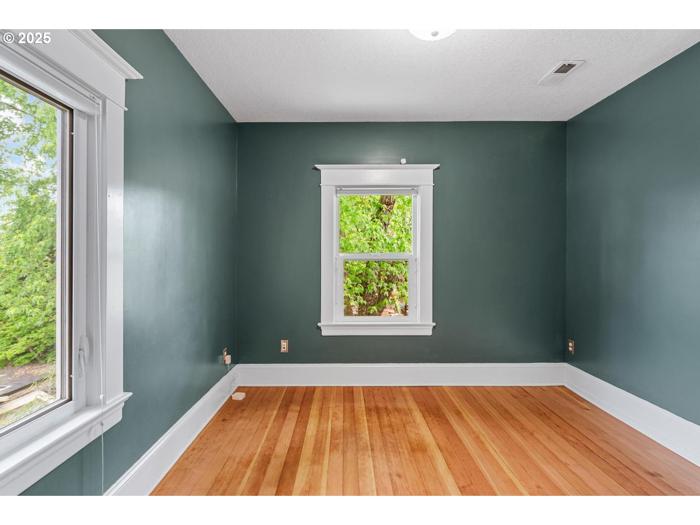 1626 Southeast 35th Avenue Portland, OR 97214 - Photo 28 of 40 an empty room with wooden floor and windows