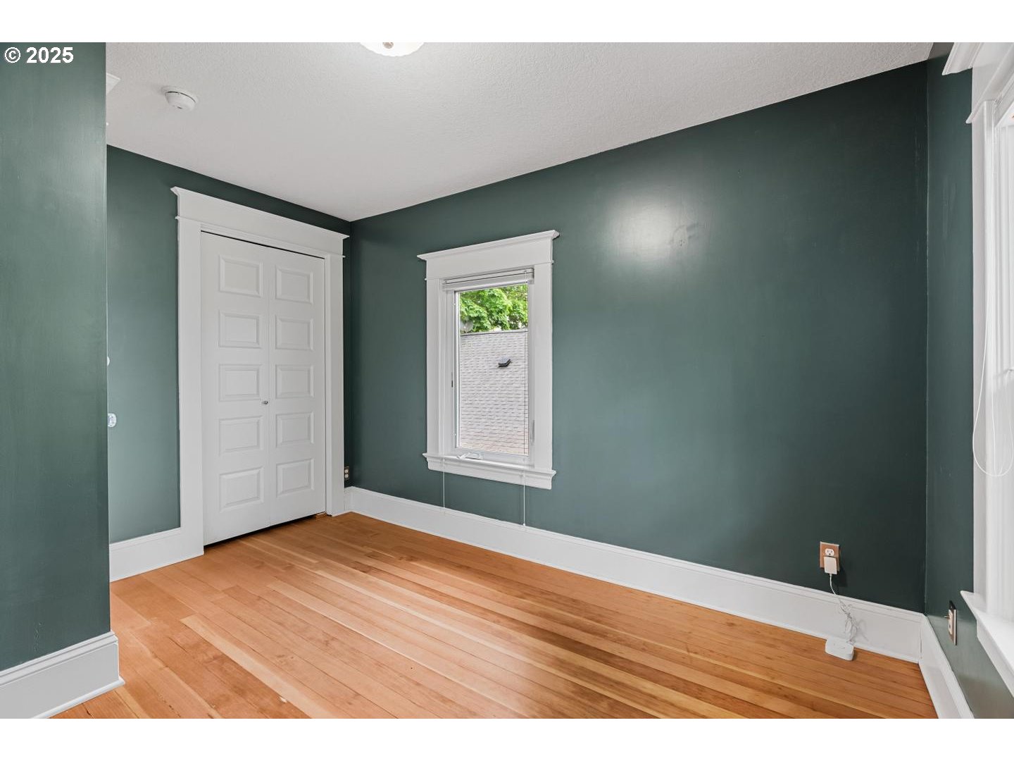 1626 Southeast 35th Avenue Portland, OR 97214 - Photo 29 of 40 a view of an empty room with wooden floor
