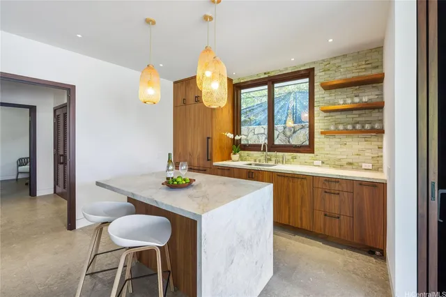 a kitchen with a sink and a large window