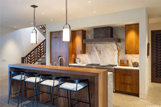 a view of a kitchen counter space and wooden floor