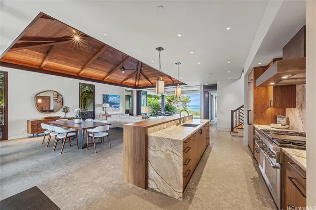a very nice looking dining room with a large window