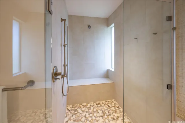 a bathroom with a tub and shower