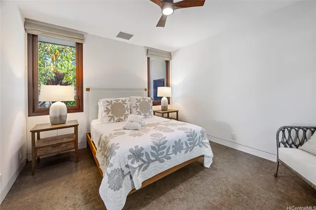 a bed room with a bed and a chair