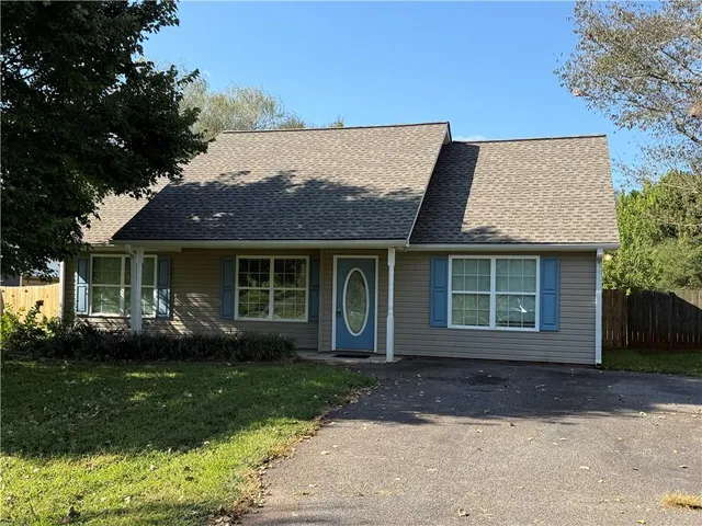 front view of a house with a yard