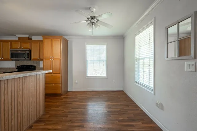 a view of kitchen and windows