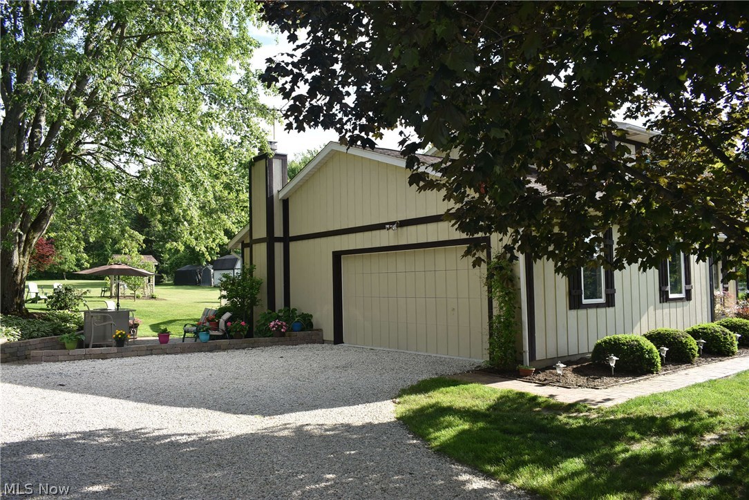 2630 Sourek Road Akron, OH 44333 - Photo 2 of 33 Custom garage door blends perfectly with the siding.