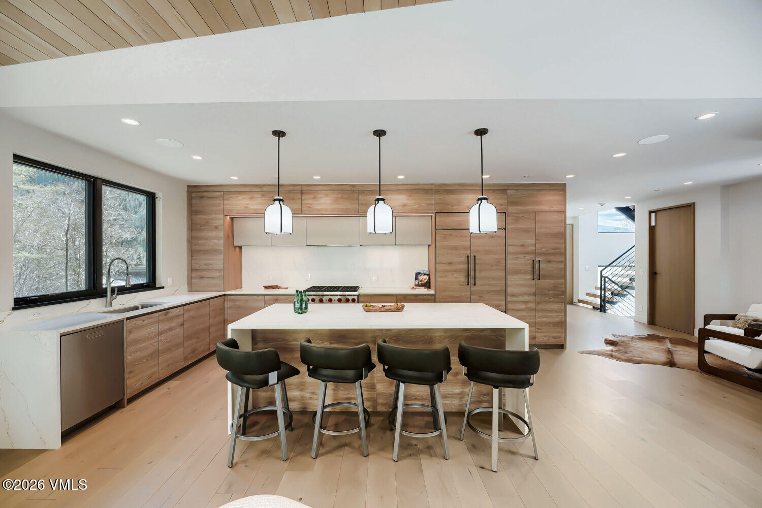 2811 Bald Mountain Road Vail, CO 81657 - Photo 22 of 59 a kitchen with a table and chairs in it