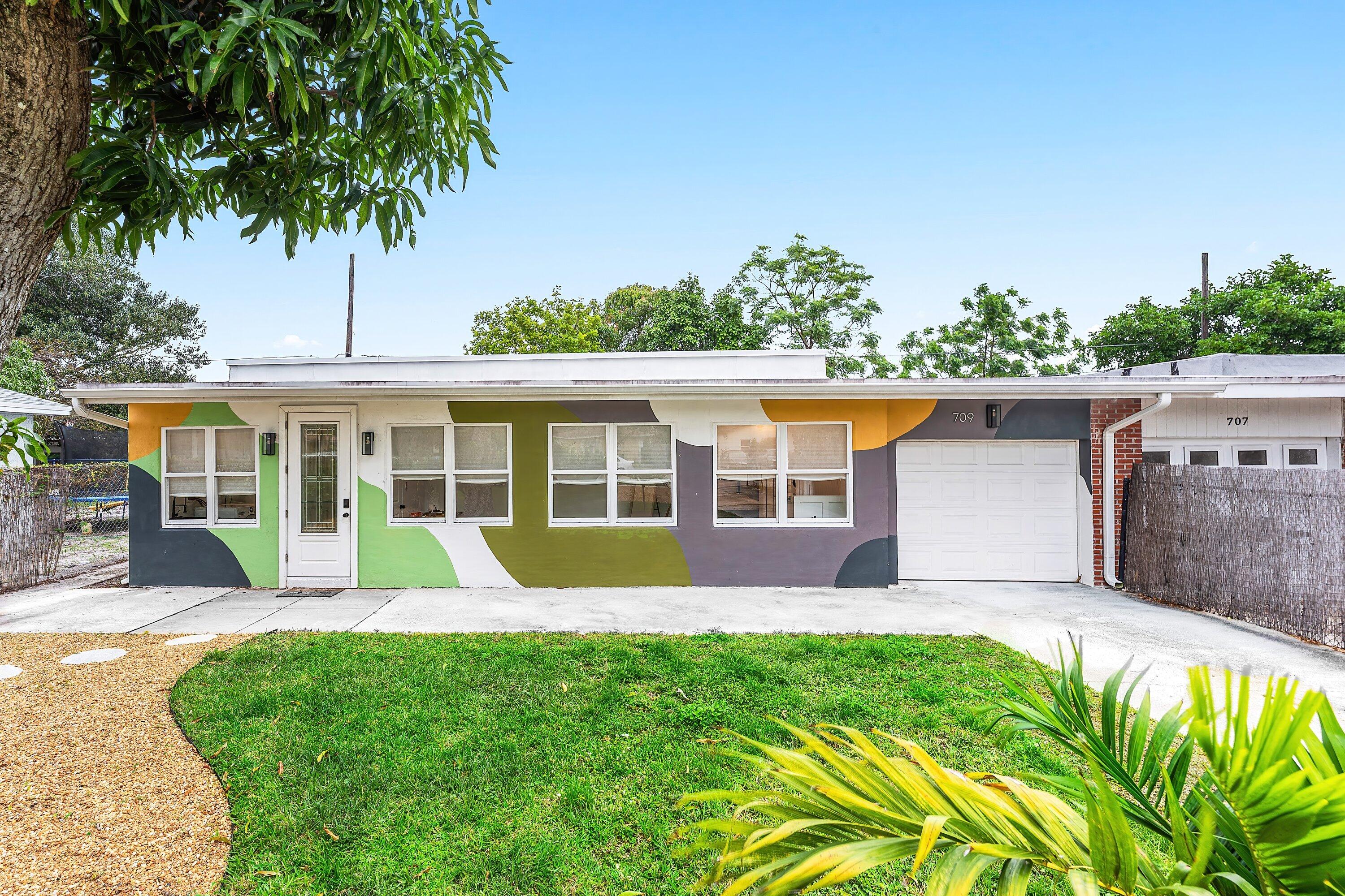 front view of a house with a yard