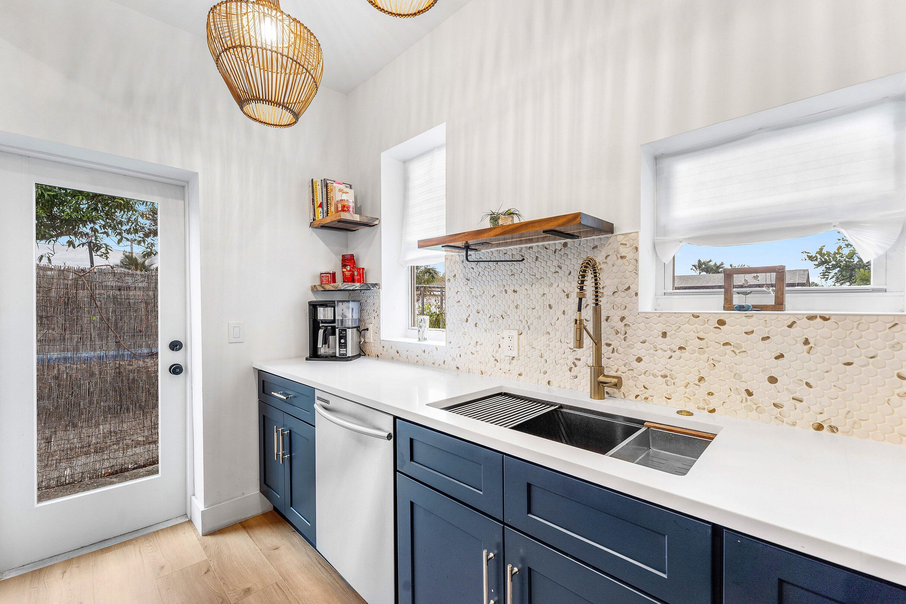 709 Southwest 9th Court Delray Beach, FL 33444 - Photo 12 of 32 a utility room with sink dryer and washer