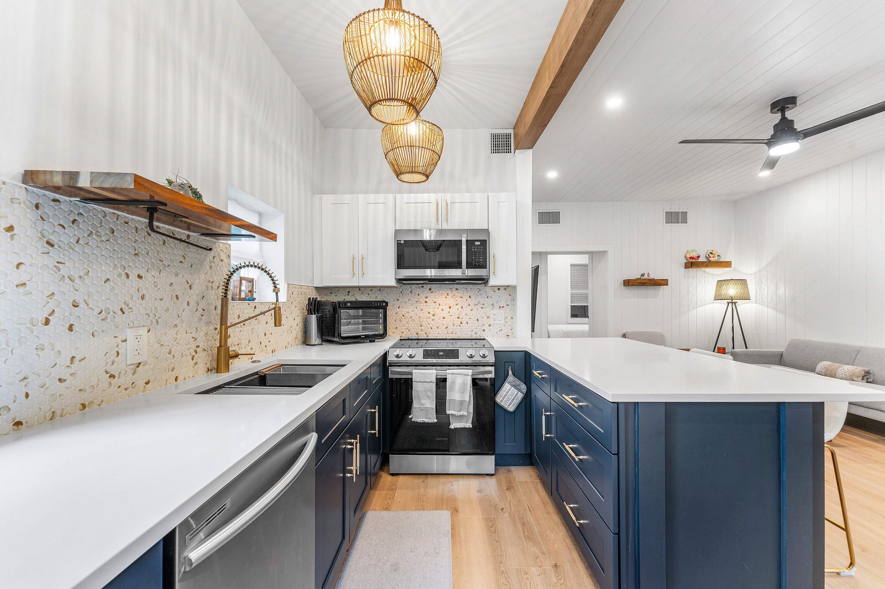 709 Southwest 9th Court Delray Beach, FL 33444 - Photo 13 of 32 a kitchen with a sink appliances and cabinets