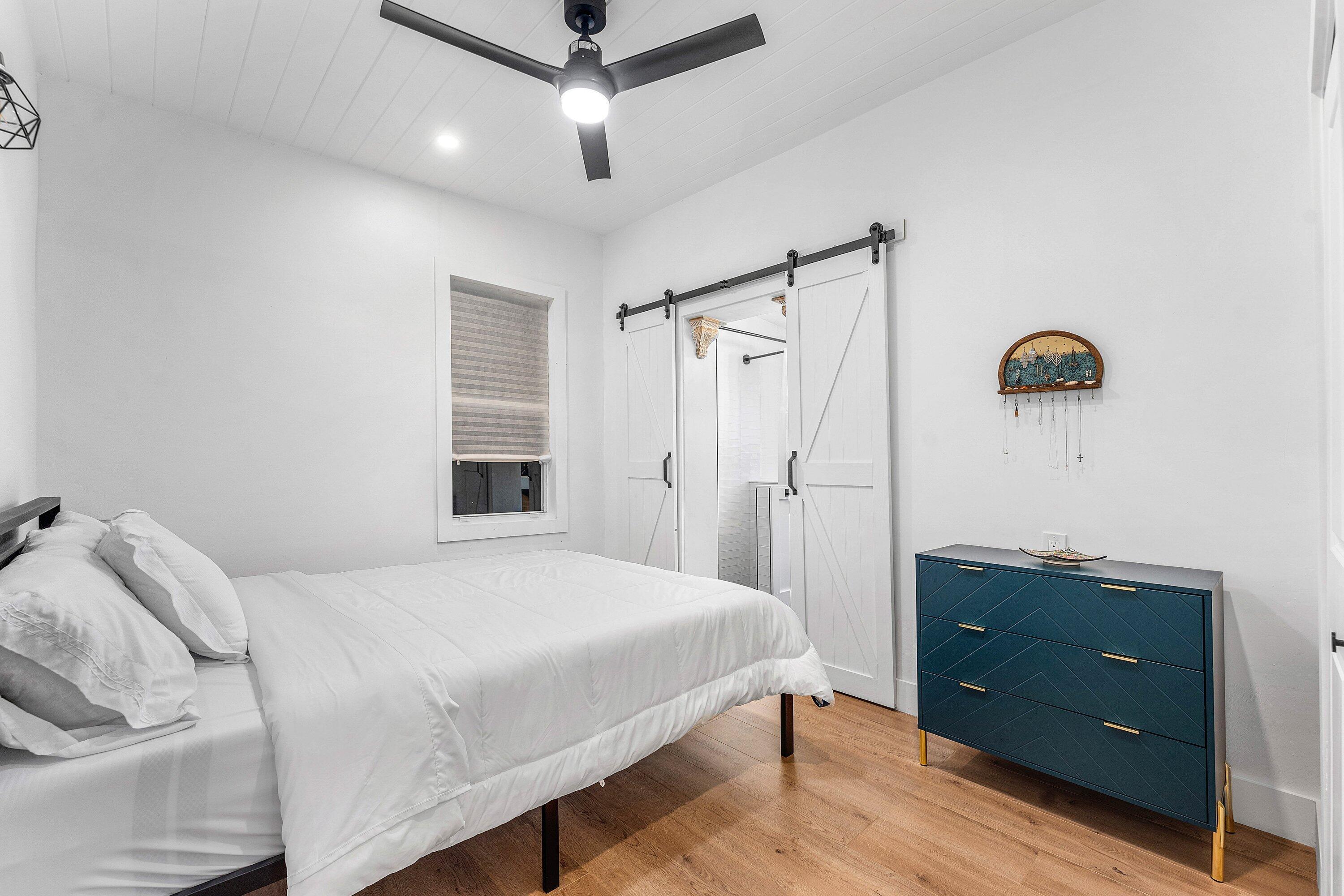 709 Southwest 9th Court Delray Beach, FL 33444 - Photo 15 of 32 a bedroom with a bed and a dresser