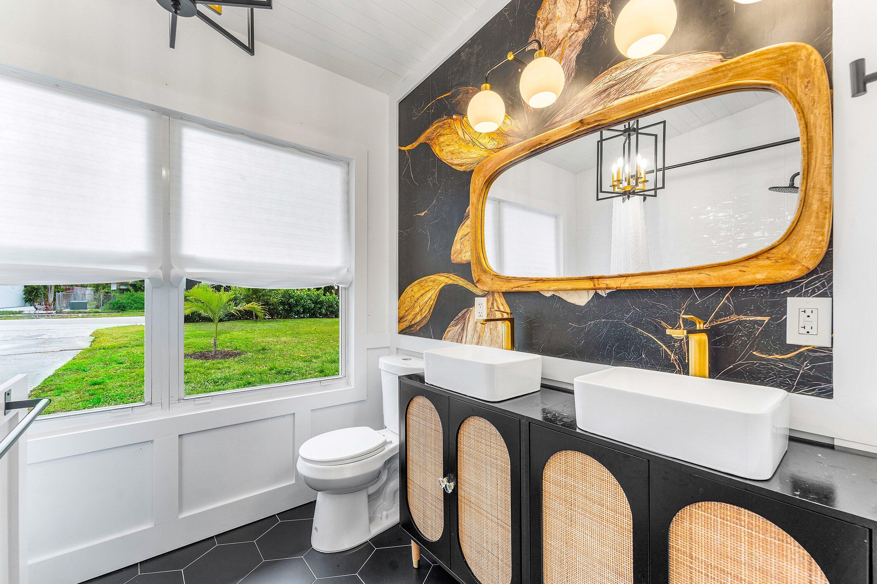 709 Southwest 9th Court Delray Beach, FL 33444 - Photo 17 of 32 a bathroom with a sink and a mirror