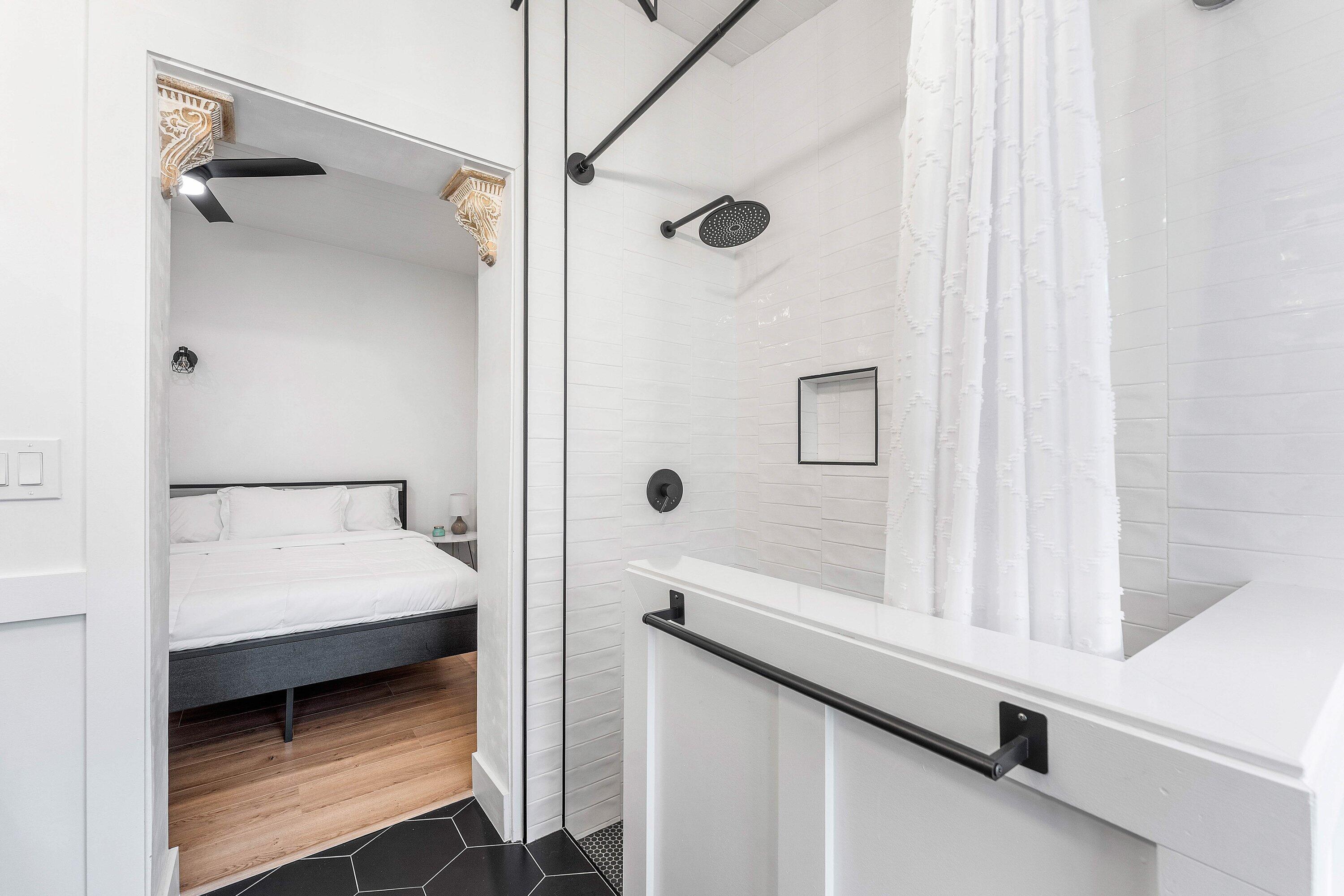 709 Southwest 9th Court Delray Beach, FL 33444 - Photo 18 of 32 a bathroom with a bathtub and a shower